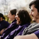 a group of people sitting next to each other