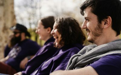 a group of people sitting next to each other